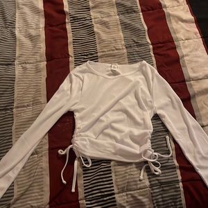 A small, white long sleeve bozzolo shirt
